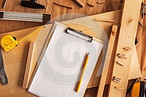 Mock up template clipboard note paper in woodwork carpentry workshop