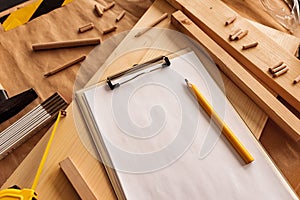 Mock up template clipboard note paper in woodwork carpentry workshop