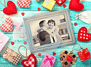 Mock up template frame for Valentine's day with heart shapes. Happy young couple in picture frame.