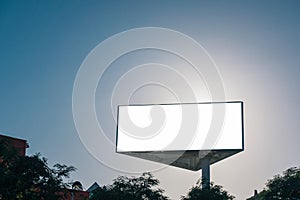 Mock up of triangle billboard or advertising poster with blue sky background