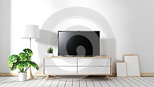 Mock up TV on cabinet in modern living room with fames lamp and plant on white wall background,3d rendering