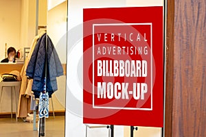 Mock up vertical billboard at the clothing store