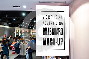 Mock up vertical signboard at the clothing store