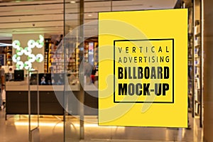 Mock up vertical signboard on glass panel of record store