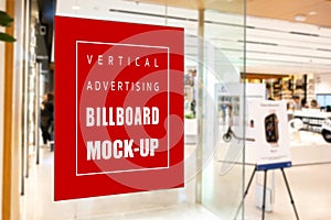 Mock up vertical signboard on glass panel of showroom