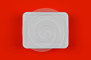 Mock-up white plastic box on red background top view, disposable packaging for products