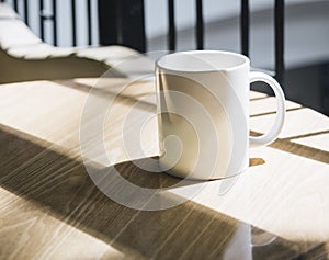 Mocked up Coffee cup on table in cafe photo