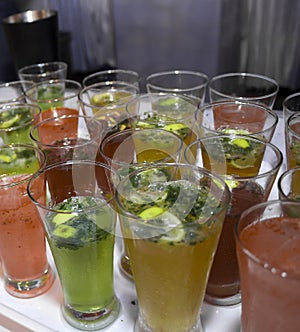 Mocktails glasses garnished with lemon and mint