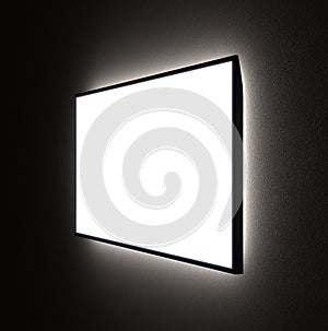 MockUp of Angle View of TV, Frame or Ad Screen with Backlight in the Dark on the Wall