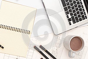 Mockup of architectural concept, Drawing tools and hot coffee on engineer drawing of blueprint