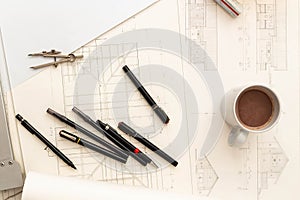 Mockup of architectural concept, Drawing tools and hot coffee on engineer drawing of blueprint