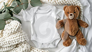 Mockup baby bodysuit with teddy bear and eucalyptus on ivory blanket for infant onesie template