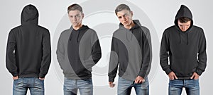 Mockup black blank hoodie on a young guy for design presentation