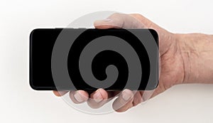 Mockup of black phone screen holding by a male hand over white background. place for picture or text
