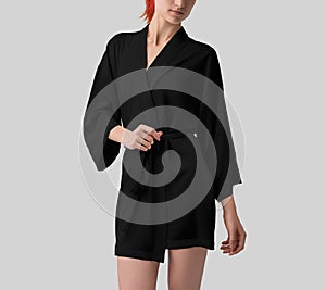 Mockup of black silk robe on red-haired girl, front view, kimono with belt for design, pattern, branding