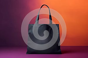 Mockup black tote bag handbag on isolated purple orange background. Copy space shopping tote eco reusable bag. Grocery accessories