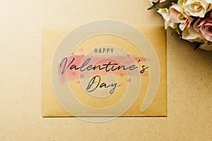 Mockup blank envelop on kraft paper for Valentine`s Day. Mock up for elegant design. Flat lay top view valentine`s day backgroun