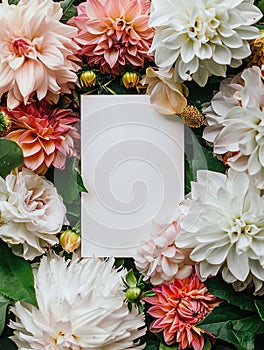 Mockup with blank greeting card with flowers and plants background. Concept invitation wedding, birthday with place for text