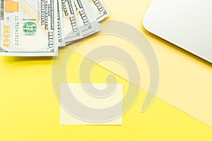 Mockup Blank page with laptop and cash money on yellow background. Top view with copy space for input the text. Flat lay, business