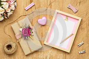 Mockup Blank photo frame for Valentines day concept. Top view of mock up photo frame with beautiful craft gift box decoration and