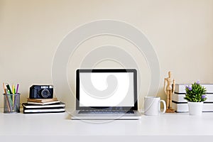 Mockup blank screen computer laptop on desk. Workspace.