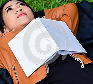 Mockup of blank white hardcover book on the top of a woman