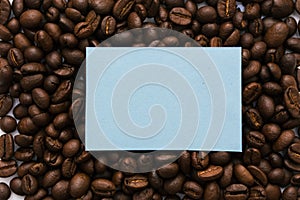 Mockup of a blue note on a solid background of coffee beans