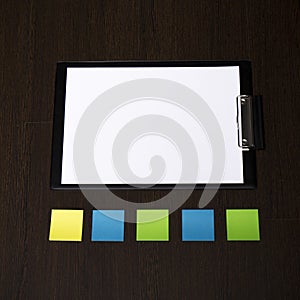 Mockup business brand template on dark wooden background. Colored reminder stickers