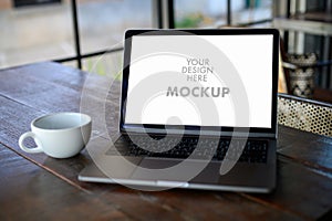 Mockup of business man using laptop screen for your advertising text message Laptop with blank screen on table compute work photo