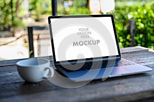 Mockup of business man using laptop screen for your advertising text message Laptop with blank screen on table compute work photo