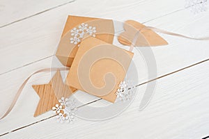 Mockup Christmas gift boxes with Christmas decorations. Greeting card with a Christmas present, wooden star and