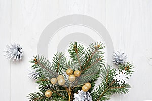 Mockup Christmas tree branch flatlay on a white wooden background, with place for your text