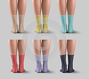 Mockup of colorful long socks on women\'s legs, back view, high gaiters with elastic band for design, branding. Set photo