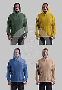 Mockup of colorful oversized hoodies with a pocket on a bearded man in a hood, sweatshirt with ties, label, set