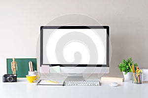 Mockup Computer on white table and designer office supplies on d