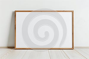 mockup of an empty blank rectangular wooden frame leaning against a white wall, a large format canvas in the minimalist style