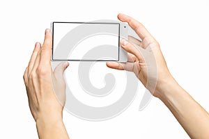 Mockup of female hand holding frameless cell phone with blank screen