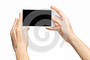 Mockup of female hand holding frameless cell phone with blank screen