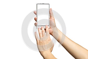 Mockup of female hands holding modern white cellphone with blank screen photo