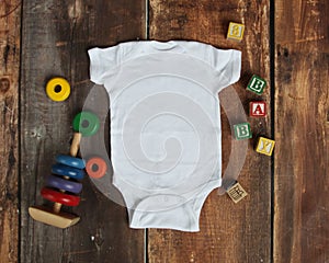 Mockup Flat Lay of white baby bodysuit shirt