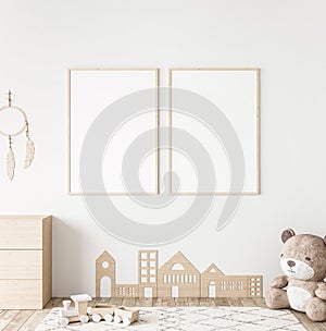 Mockup frame in minimal unisex child bedroom with natural wooden furniture photo