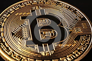 Mockup golden bitcoin close up on black background with clipping path. Bitcoin or BTC is the most popular cryptocurrency