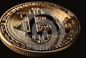 Mockup golden bitcoin close up on black background with clipping path. Bitcoin or BTC is the most popular cryptocurrency in the