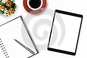 Mockup image of black mobile digital tablet computer with blank screen, diary notebook and cup of coffee on modern white office de