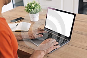 mockup image blank screen computer,cell phone with white background for advertising text,hand man using laptop texting mobile