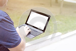 Mockup image blank screen computer with white background for advertising text, hand using laptop contact business search informati