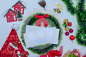 Mockup Image of a Blank White Greeting Card With Christmas Themed Decorations