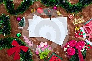 Mockup Image of a Blank White Greeting Card With Christmas Themed Decorations