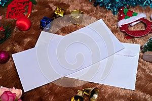 Mockup Image of a Blank White Greeting Card With Christmas Themed Decorations