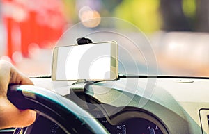 Mockup image of car holding mobile phone with blank white screen in car